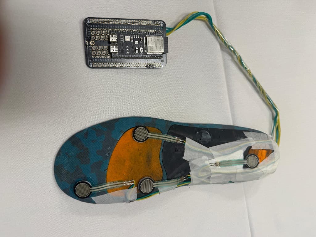 Gait AI smart insole with FSR force sensors soldered to protoboard and connected to ESP32 microcontroller