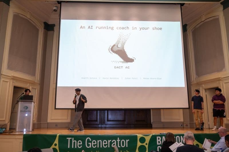 Gait AI team presenting on stage at The Generator Buildathon at Babson College