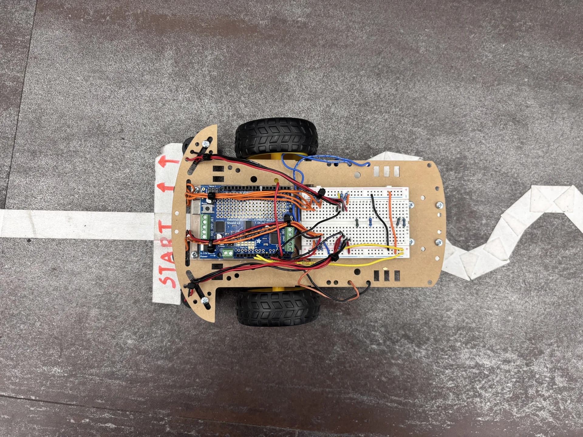 Top view of the line-sensing robot showing wiring layout and component arrangement